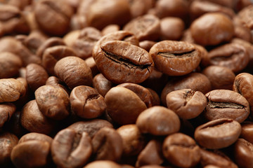 Roasted coffee beans close up. Espresso dark, aroma, black caffeine drink