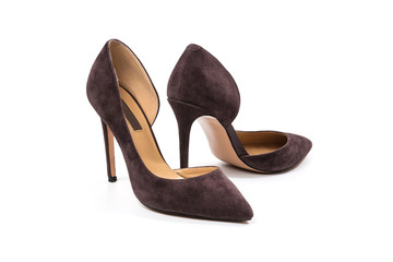 Stylish classic suede women's leather shoes with medium high heels on an isolated white background....