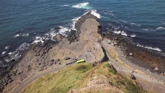 Directly Above The Giant's Causeway Of North Ireland Detailing The How The Formation Protrudes From The Cliffs Into The Sea.