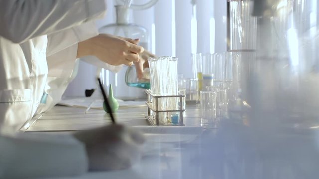 Researcher chemist conducting experiments in a laboratory test tube