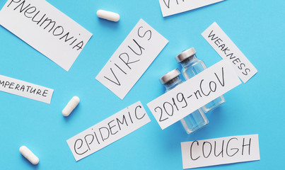 Coronavirus. 2019-nCoV concept. Syringe, vaccine, pills and paper with an inscription Coronavirus.