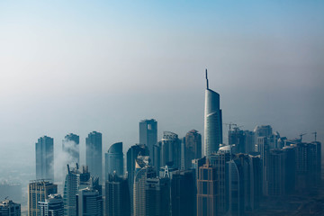 Dubai skyline, an impressive aerial top view of the city in Dubai Marina on a foggy day. October 2019