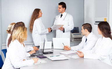 Fototapeta premium Congratulation of a female young doctor