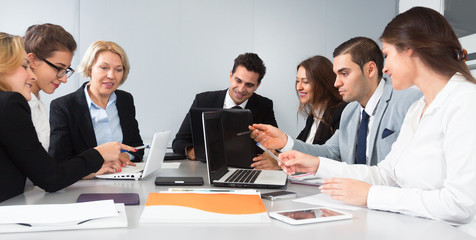 colleagues in negotiations in conference room