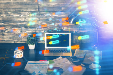 Double exposure of laptop computer and technology theme hologram. Concept of freelance work.