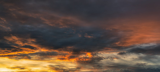 Fototapeta premium Beautiful dramatic orange sky during sunset.