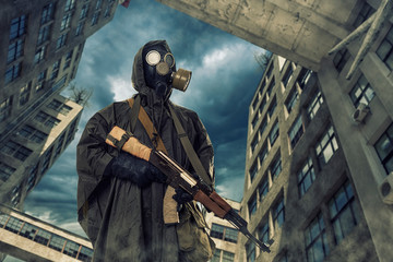 lonely post survivor in mask wanders through the ruined city.