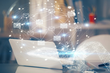 Desktop computer background in office and flying envelops hologram drawing. Multi exposure....