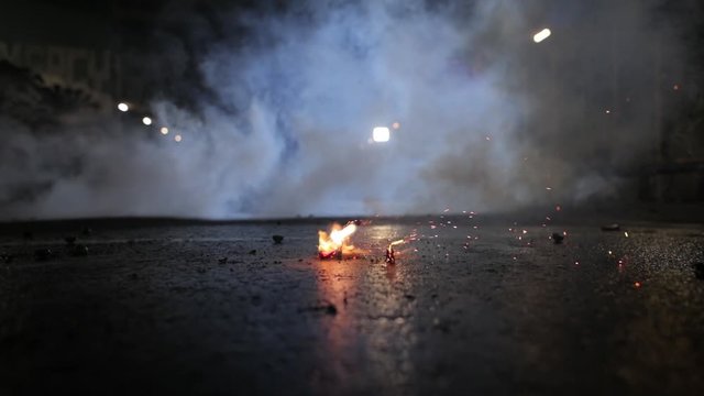 Fireworks Spark With Smoke On The Ground At The Basketball Court - Close Up Shot