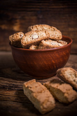Cantucci cookies with almonds on rustic wooden background