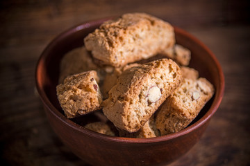 Cantucci cookies with almonds on rustic wooden background