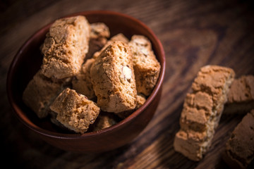 Cantucci cookies with almonds on rustic wooden background