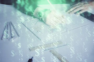 Double exposure of man's hands writing notes of stock market with forex chart.