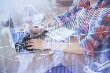 Multi exposure of forex graph with man working on computer on background. Concept of market analysis.