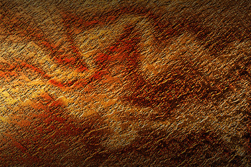 dark rock wall with light and shadow.