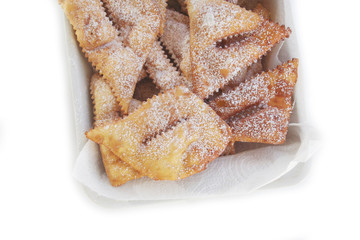Italian carnival pastry on white. Traditional carnival pastry, chiacchere or crostoli, bugie, cenci isolated on white background