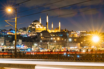 Fototapeta na wymiar Istanbul, Turkey - Jan 15, 2020: Suleymaniye Mosque with Galata Bridge at night, Istanbul, Turkey.