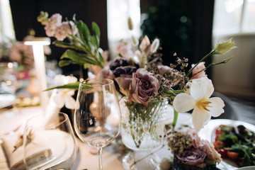 wedding table decoration with fresh flowers on wedding party
