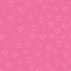 seamless pattern hand-drawn white chalk hearts of different sizes and shapes on a pink background. delicate soft pattern for romantic and kids textiles wrapping card banner fabric