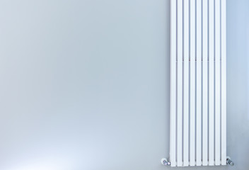 white radiator on gray wall in office