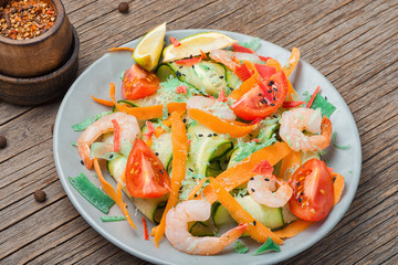 Shrimp salad on wooden table