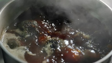 Top view fresh beet cooking at boiling water pan slow motion. Close up shot on 4k RED camera