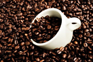 White coffee cup and roasted coffee beans