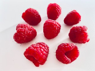 raspberries on white background