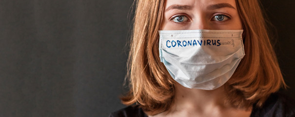 Close-up portrait of a girl in a mask of exhilaration with suspected coronavirus. New...