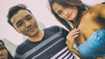 Happy young asian friends enjoying city view outdoor