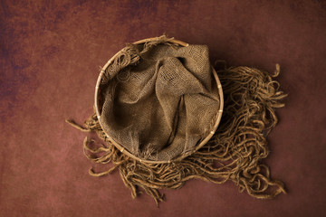 Newborn photography digital background prop. wicker basket on a painted canvas.