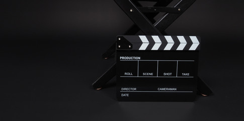 clapper board or movie slate  and director chair use in video production and cinema industry on...
