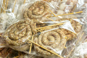 Handmade frozen spiral sausages.