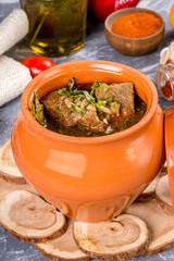Kharcho soup with meat in a pot filmed in a decor