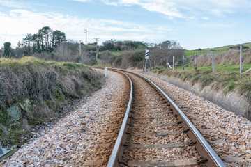 Obraz premium Train track stretch in the town of Ribadesella area, Principality of Asturias, northern Spain