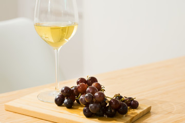 Wine in glass and grape