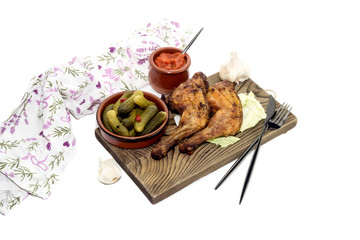 Fried chicken legs on a cutting board close-up.