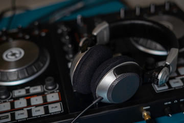 Fototapeta na wymiar Headphone and sound audio controller. music mixer dj pult