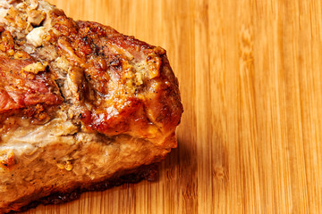 baked meat cut into pieces close up photo