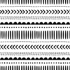 African hand drawn vector seamless pattern. Geometrical black doodle shapes on white background. Dot, zigzag, dash line decorative backdrop. Monochrome wrapping paper, wallpaper design