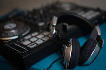 Obraz na płótnie Canvas Headphone and sound audio controller. music mixer dj pult