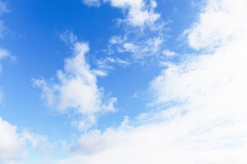 Blue sky background. Blue sky with fluffy white clouds