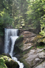 View of a waterfall flowing over a rock edge.