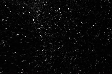 Texture of falling snow at night