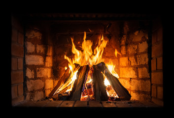 Firewood burning in a fireplace close-up