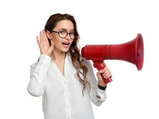 Young woman with megaphone on white background