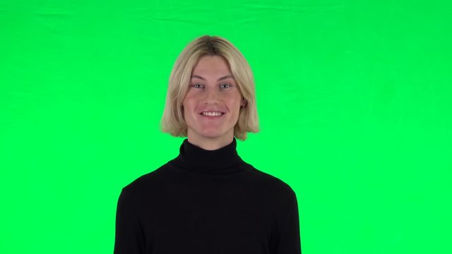 Blonde surprised guy with shocked wow face expression. Green screen