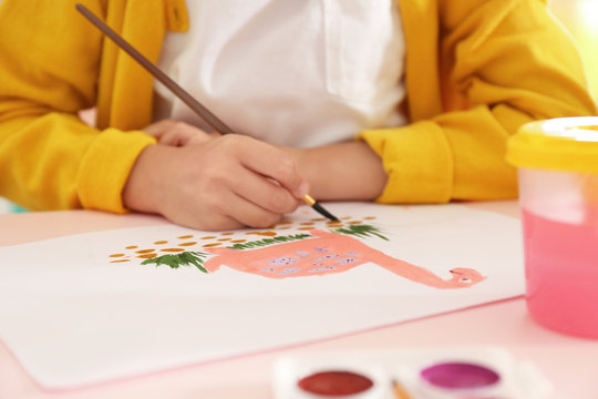 Little child painting at table, closeup view