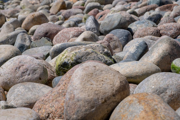 Pebble beach background. Pebbles. Selective focus.