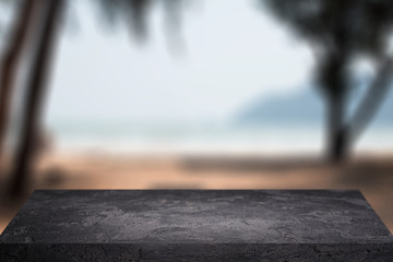 Stone surface on blurred background of palm trees, sand, sky. Mock up for display